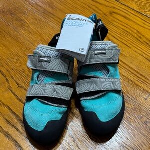 Scarpa Origin climbing shoes.  New with book attached. Size EU 39 Womens 7.5.